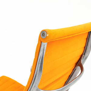 SOLD 1970s Eames Aluminum Group Lounge Chair, model EA124 by Ray and Charles Eames for Herman Miller in Orange Alexander Girard-Designed Hopsack Fabric