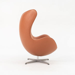 1990s Egg Lounge Chair and Ottoman by Arne Jacobsen for Fritz Hansen in New Cognac Leather