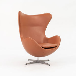 1990s Egg Lounge Chair and Ottoman by Arne Jacobsen for Fritz Hansen in New Cognac Leather