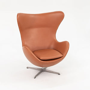 1990s Egg Lounge Chair and Ottoman by Arne Jacobsen for Fritz Hansen in New Cognac Leather