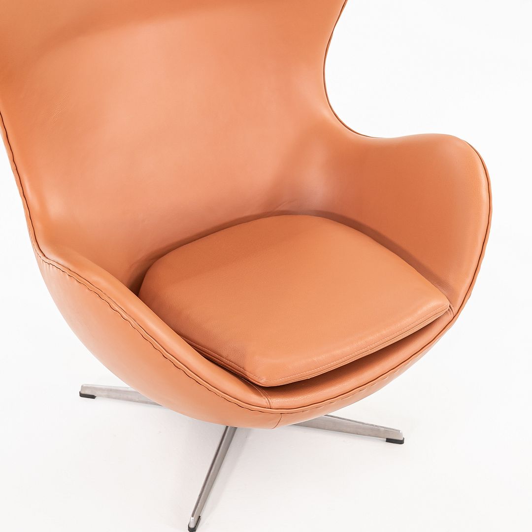 1990s Egg Lounge Chair and Ottoman by Arne Jacobsen for Fritz Hansen in New Cognac Leather