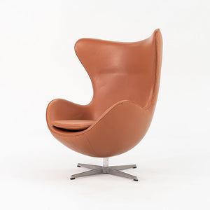 1990s Egg Lounge Chair and Ottoman by Arne Jacobsen for Fritz Hansen in New Cognac Leather