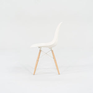 2018 DSW Side Chair with Dowel Base by Ray and Charles Eames for Herman Miller in White Plastic with Oak Base 5x Available