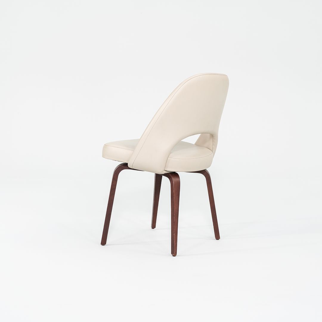 2009 Set of Four Eero Saarinen for Knoll Armless Executive Side Dining Chairs in Cream Leather with Walnut Wood Legs