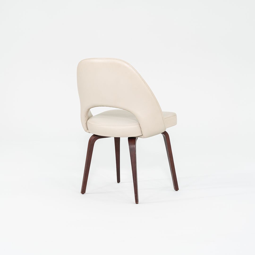 2009 Set of Four Eero Saarinen for Knoll Armless Executive Side Dining Chairs in Cream Leather with Walnut Wood Legs