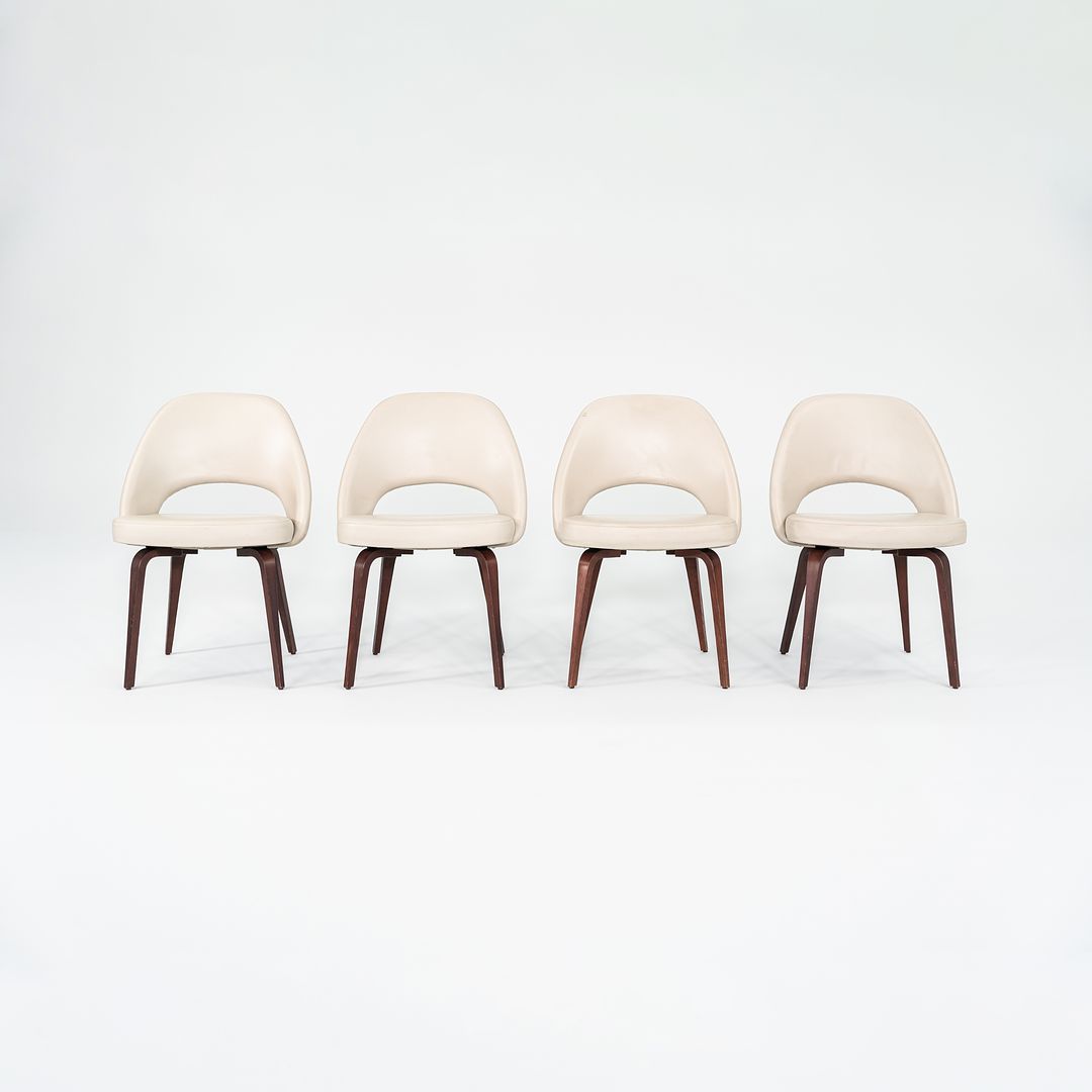 2009 Set of Four Eero Saarinen for Knoll Armless Executive Side Dining Chairs in Cream Leather with Walnut Wood Legs